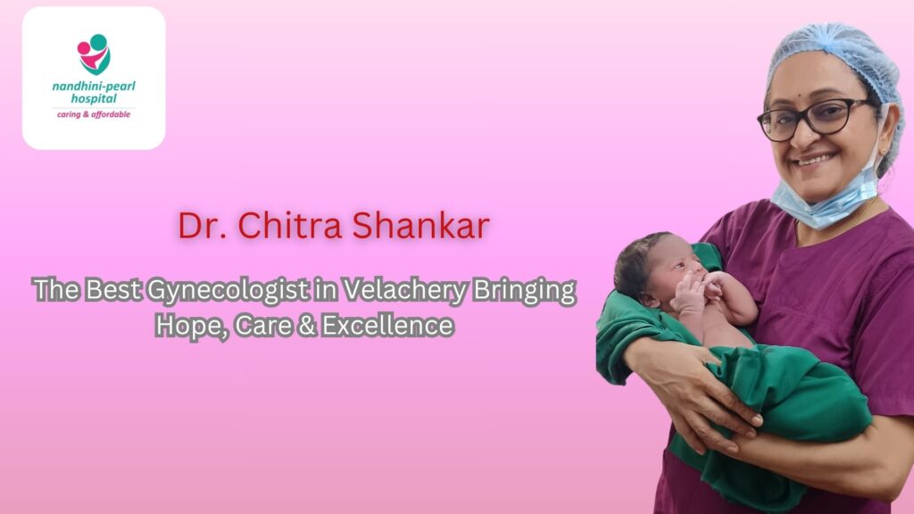 Dr. Chitra Shankar, gynecologist at Nandhini-Pearl Hospital, Velachery, smiling while holding a newborn baby, representing expert maternity and gynecology care.